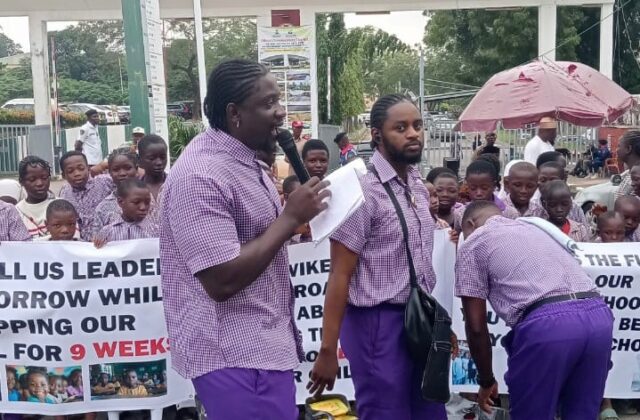 VeryDarkMan Stages Protest with Public School Pupils at FCT Minister's Office Amid Long Strike by Teachers Over Government's Refusal to Pay N70,000 Minimum Wage
